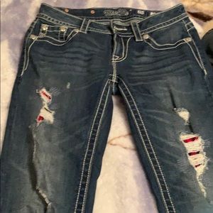 Distressed blue jeans